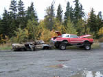 A burned out car being hauled to the Pavilion Parking area during the ATV Club Fall Cleanup event