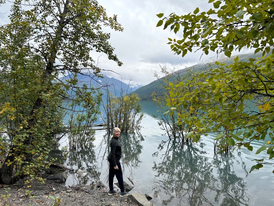 Deborah Dickerson above the flooded banks
