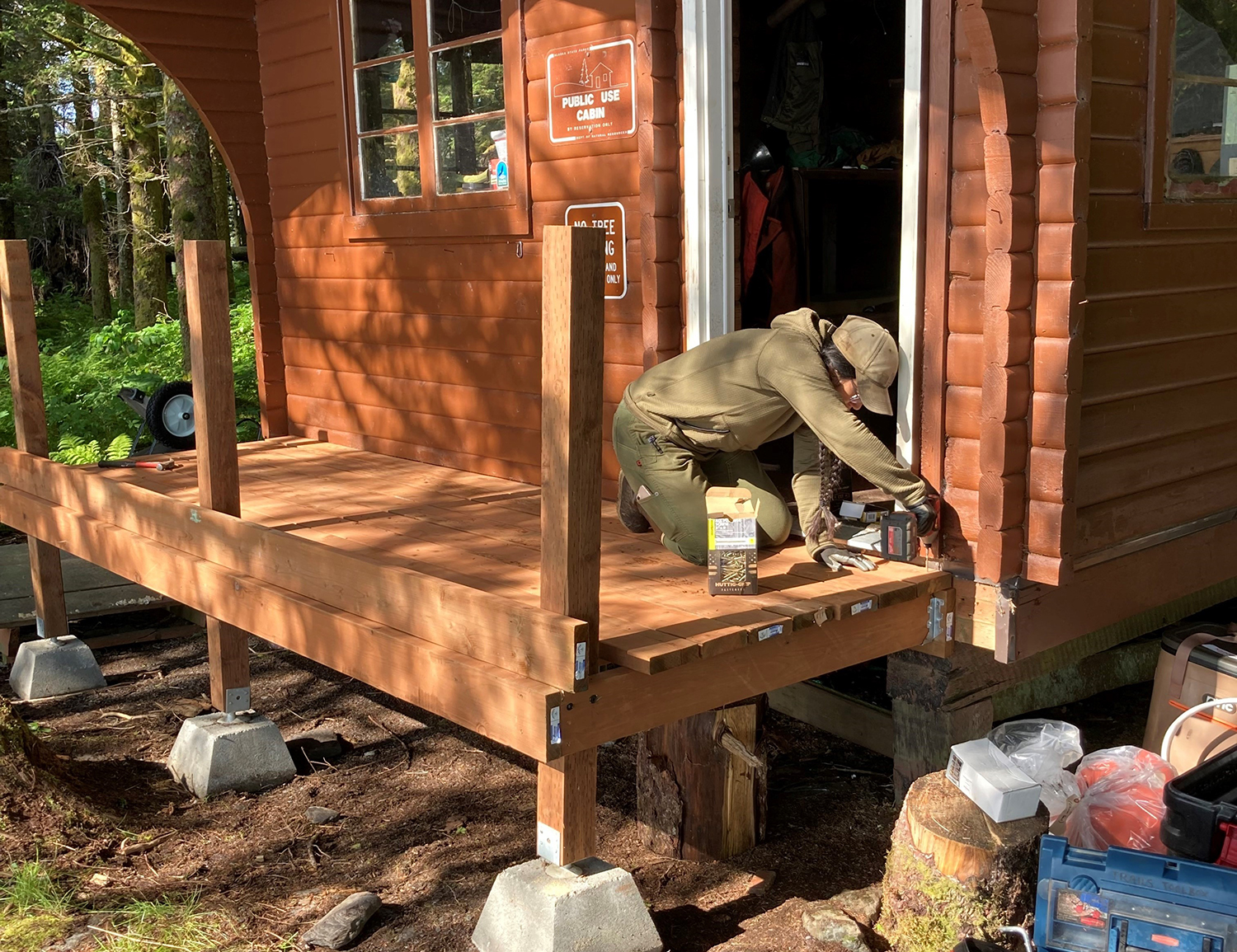 ACC working on installing a deck on a public use cabin
