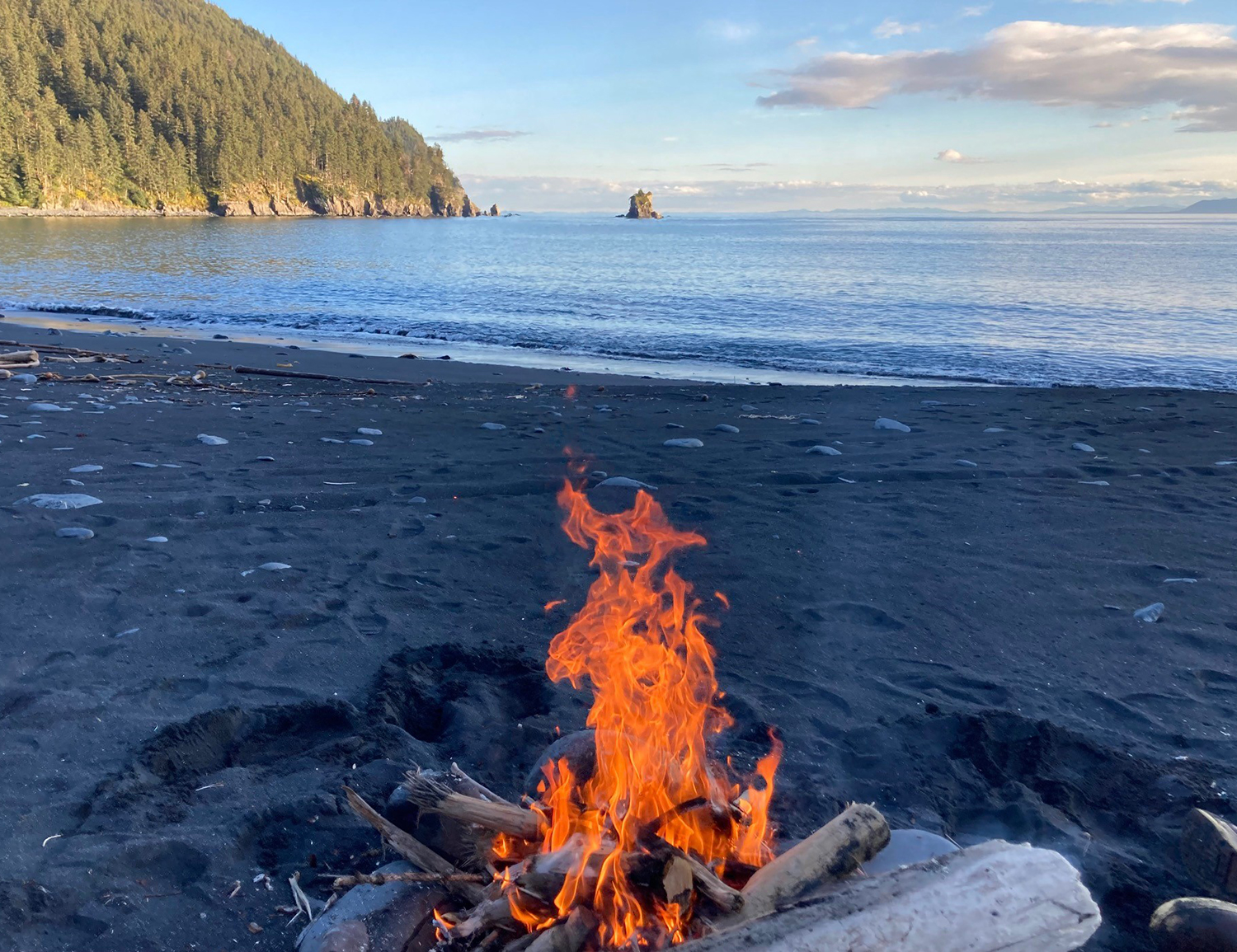campfire on oceanside beach