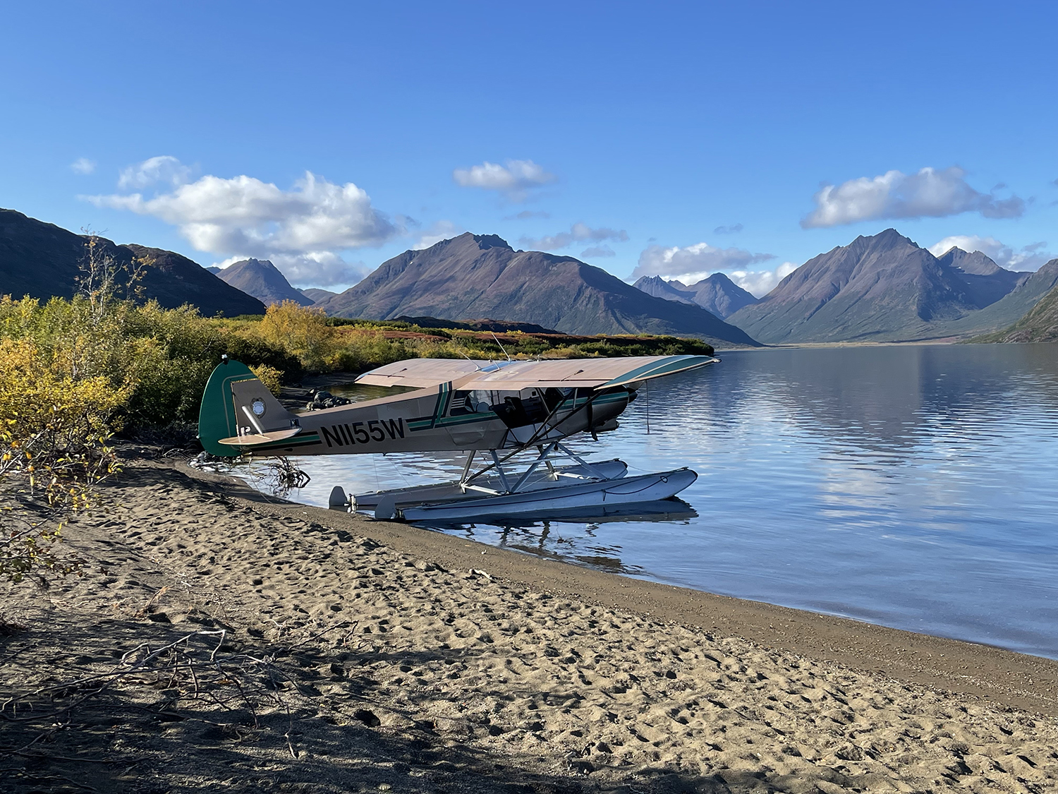 Piper Cub Floatplane shored on beach