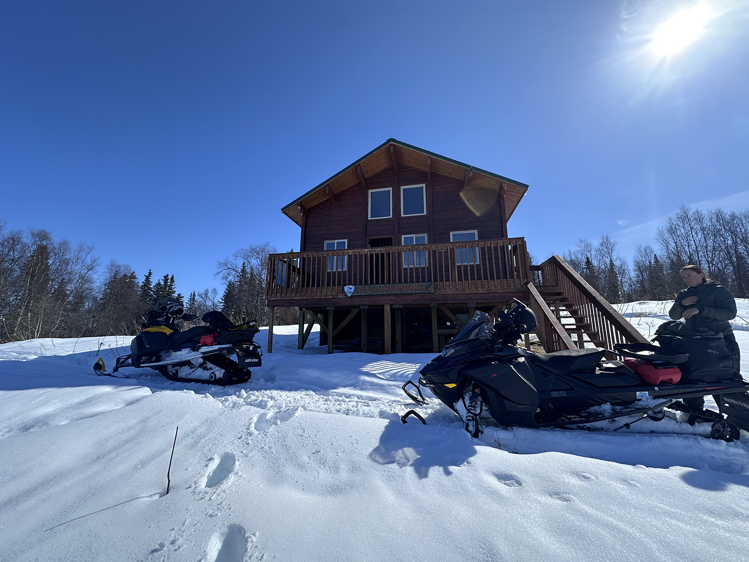 Parks staff during wintertime with snow machines at the Agulukpak Ranger Station