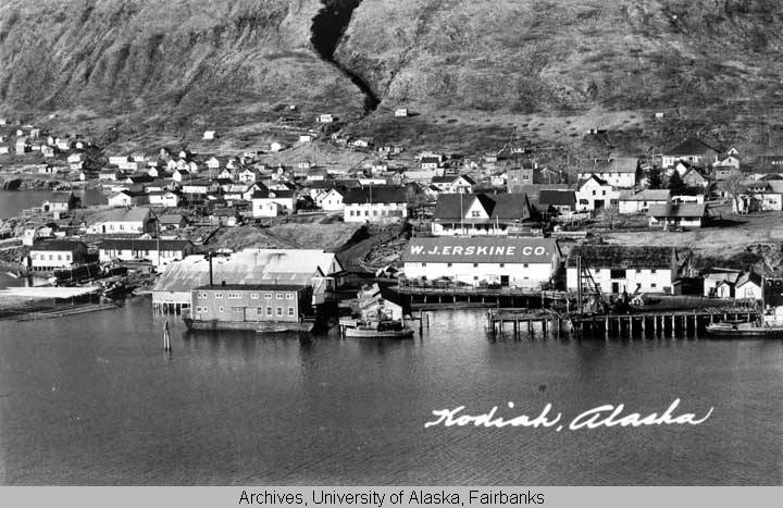 Views of Kodiak waterfront, circa 1940, with Russian Magazin visible. Image taken for a postcard, with a caption that reads Kodiak, Alaska. Courtesy of University of Alaska Fairbanks, Alaska and Polar Regions Collections, O.B. Chamberlain Collection, UAF-1972-154-3.