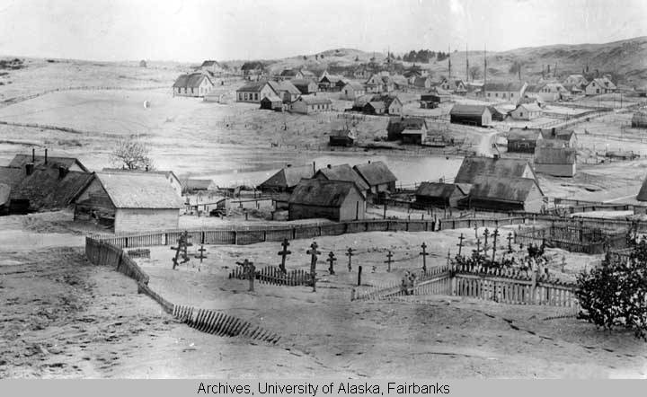 A graveyard and many homes are covered in ash from the 1912 Katmai Eruption. Image courtesy of University of Alaska Fairbanks, Alaska and Polar Regions Collections, Amelia Elkinton Collection, UAF-1974-175-376.