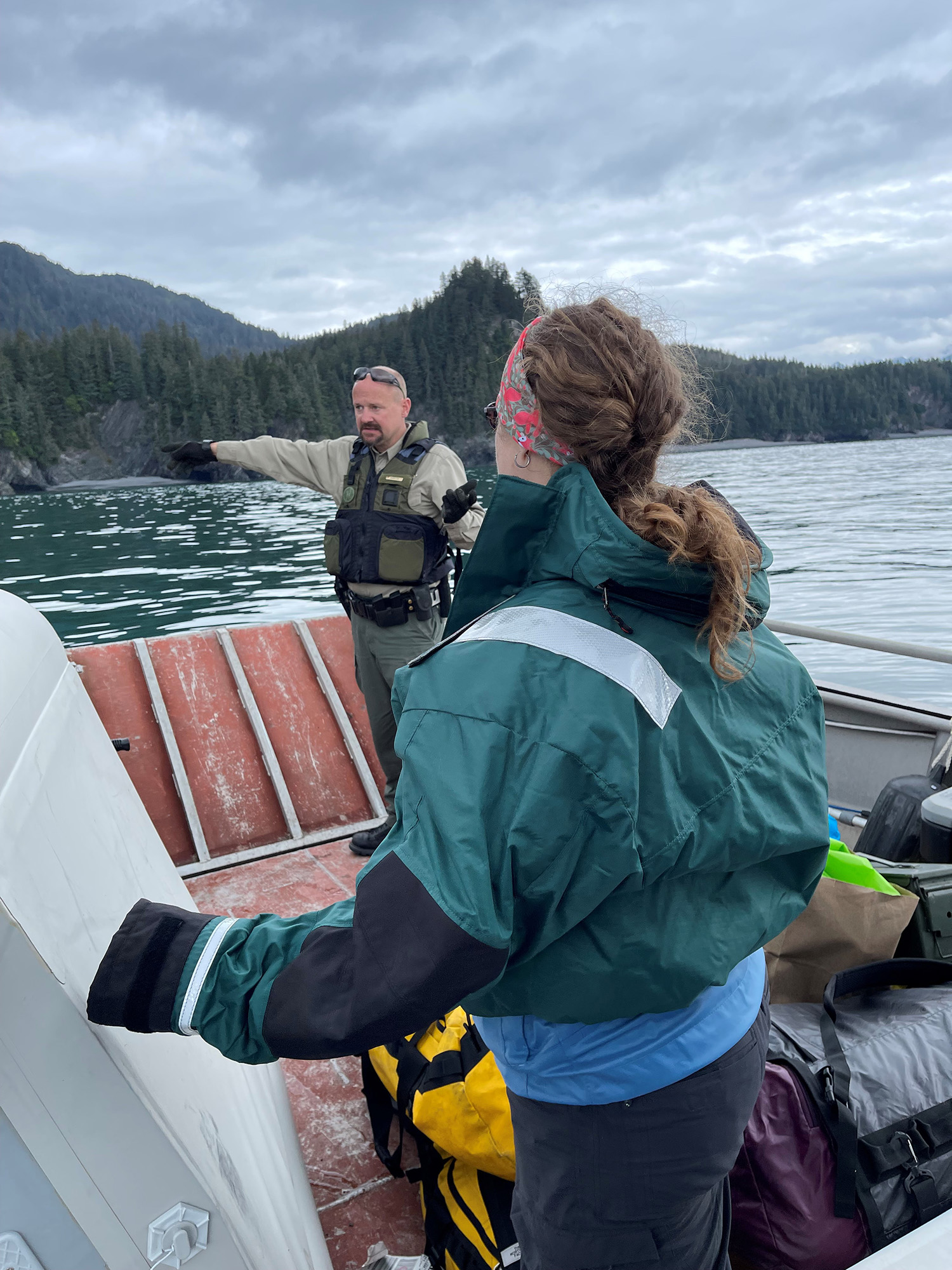 OHA team leader, Sarah Meitl, listens to Park Ranger Jack Ransom interpret the history and geography of Caines Head. September 2021
