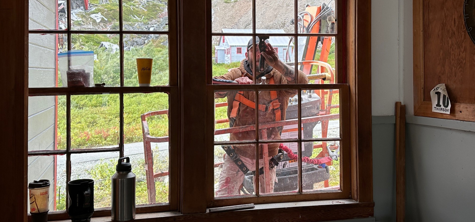 Independence Mine State Historical Park Rehabilitation, worker repairing a window