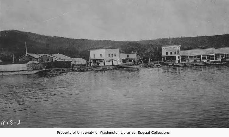 Buildings and railroad cars in Chena, seen from Tanana River, Alaska. 1914. University of Washington Libraries and Special Collections. The image illustrates an excellent example of the use of false-front architectural style found in early settlements of Interior Alaska.