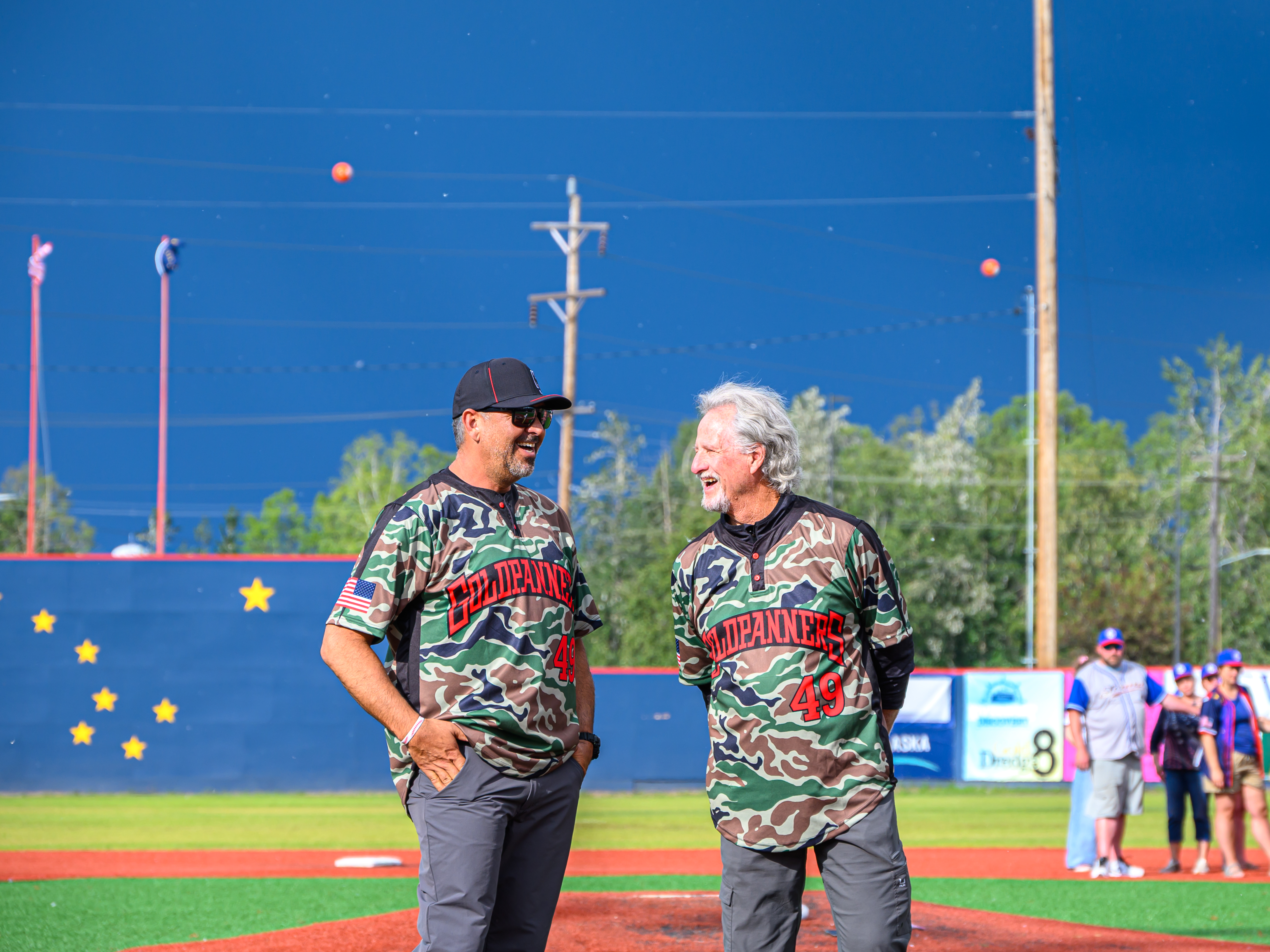 Greg Harris and one other wearing camouflage Goldpanners jersies
